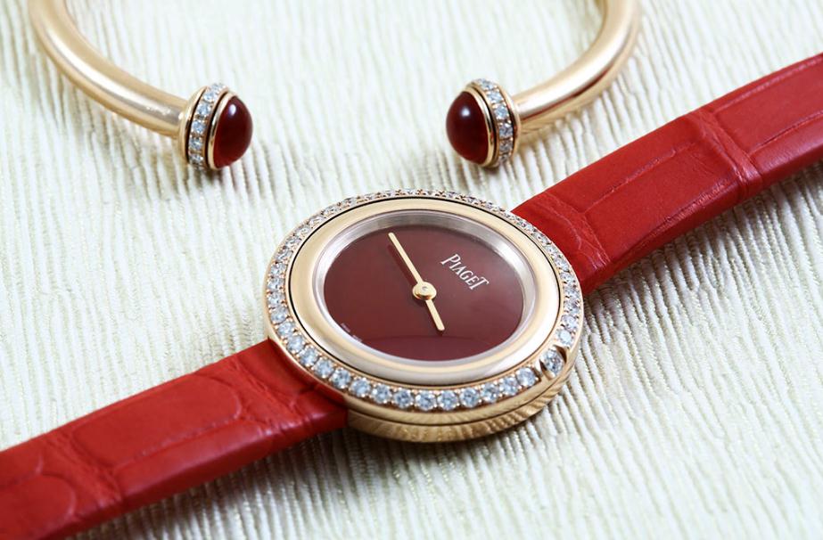 The 18k rose gold copy watches have red leather straps.